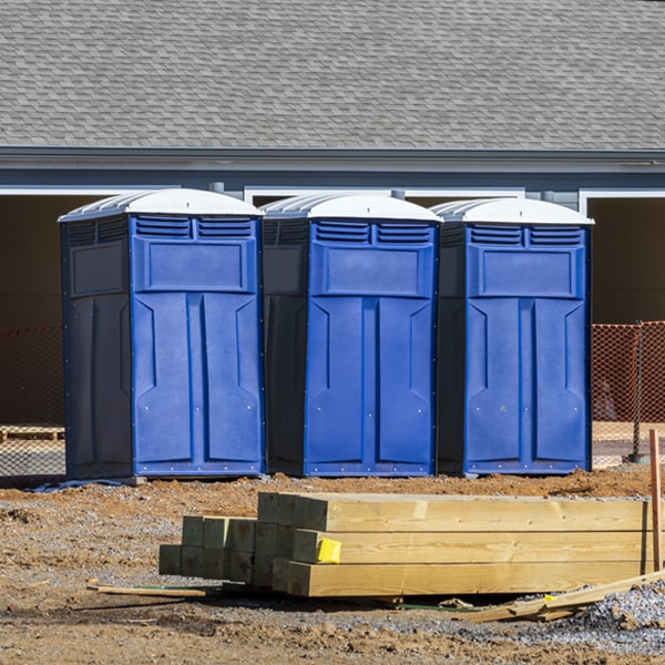 what is the cost difference between standard and deluxe portable toilet rentals in Miller